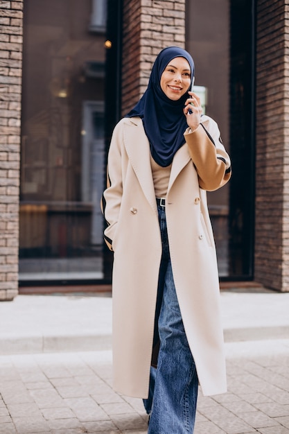 Modern muslim woman talking on the phone