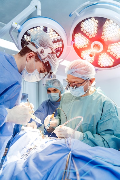 Modern neurosurgery doctors operating in hospital Medical surgery specialists