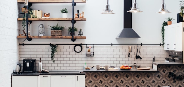 Modern new light interior of kitchen with white furniture