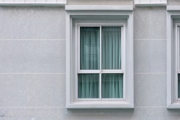 Modern new residential building windows with curtain uv protection inside. outdoor view.