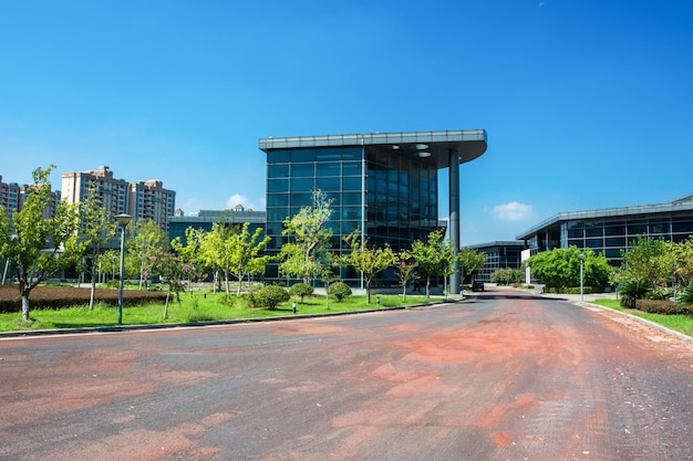 Modern office building with traffic in motion blur