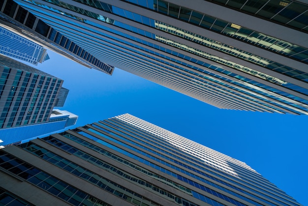 Modern office glasses buildings cityscape under blue clear sky in Washington DC, USA, outdoors financial skyscraper concept, symmetric and perspective architecture