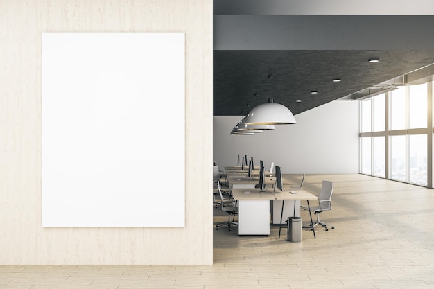 Modern office interior with blank poster on wall