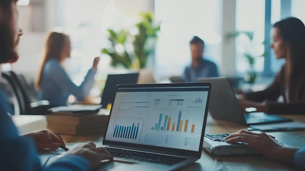 A modern office with professionals collaborating around a table discussing charts and graphs with