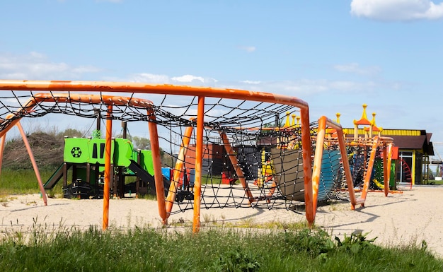 Modern public playground against the blue sky A colorful play and sports complex for children