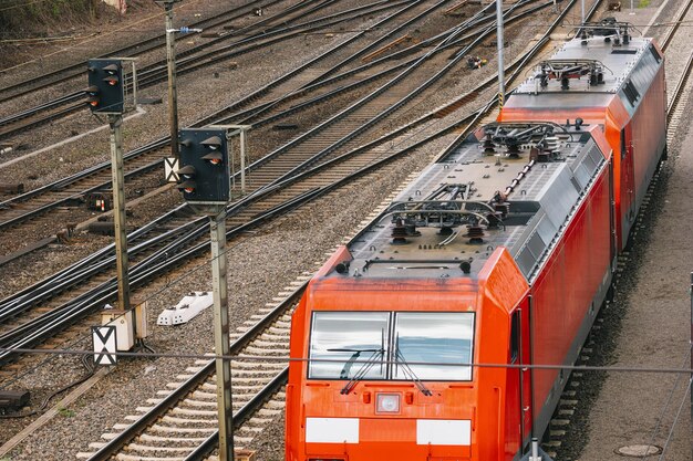 Modern red commuter train at the railway station