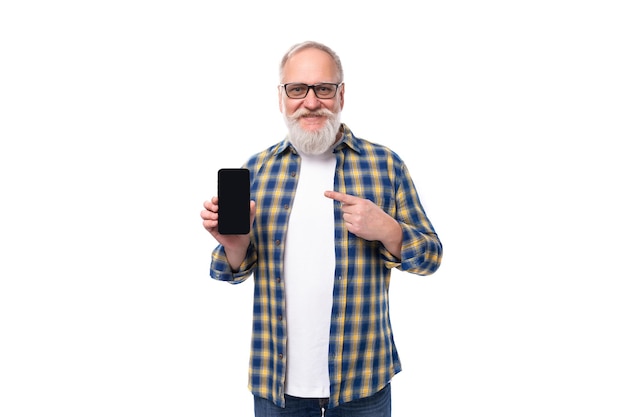 Modern senior grayhaired retired man with mustache and beard shows phone screen