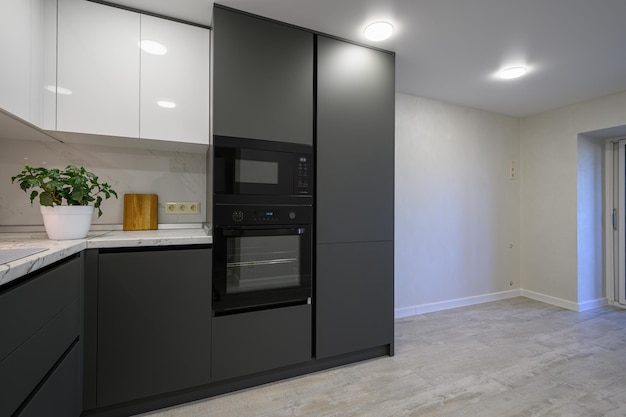 Modern simple trendy dark grey and white kitchen