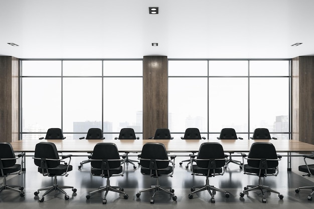 Modern spacious meeting room with big window wooden table in the center and black chairs around