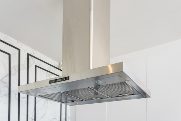 Modern stainless steel And Range hood in the kitchen interior. 