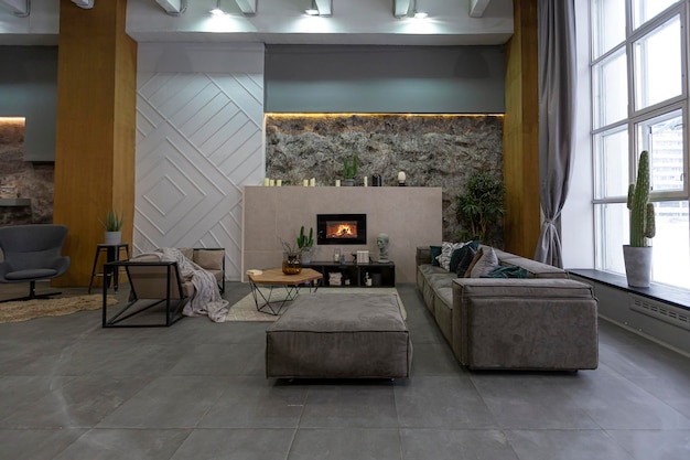 Modern studio interior with decorative stone walls in grey stone wood tiles and led lighting in the design of the room