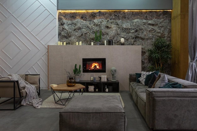 Modern studio interior with decorative stone walls in grey stone wood tiles and led lighting in the design of the room