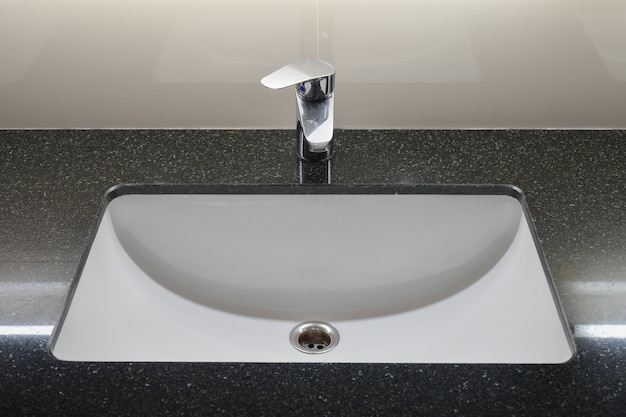 Modern style faucet with black granite counter top