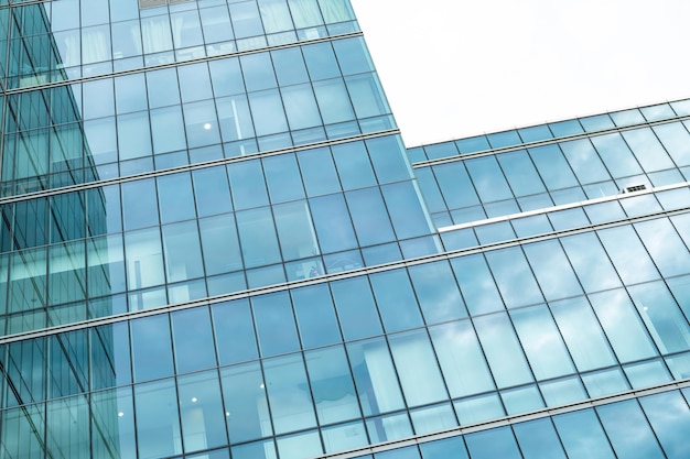 Modern sustainable glass office building Exterior view of corporate headquarters glass building