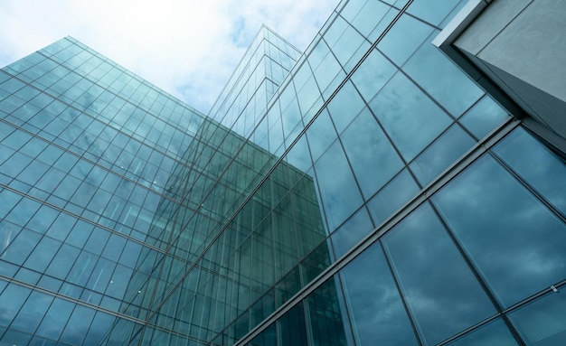 Modern sustainable glass office building Exterior view of corporate headquarters glass building