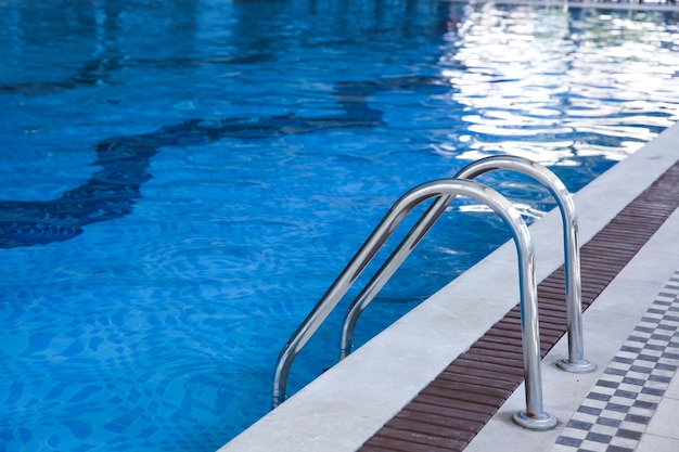 Modern swimming pool with stair closeup