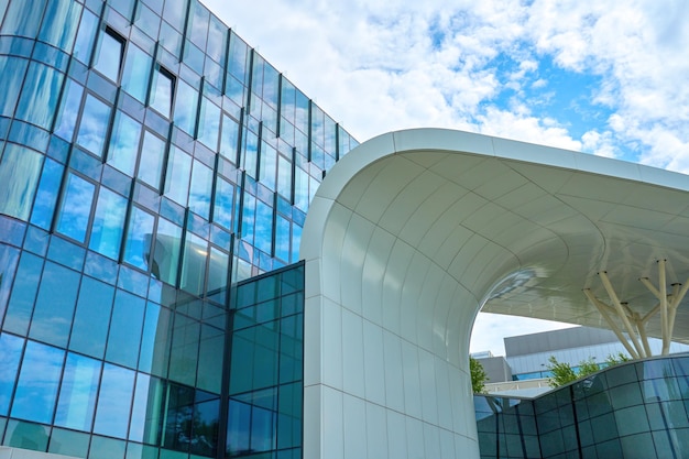 Modern urban architecture Futuristic building facade against blue sky