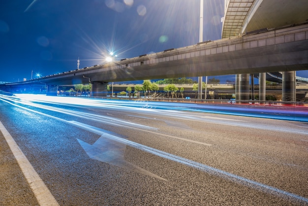 Modern urban construction and road vehicles, night view