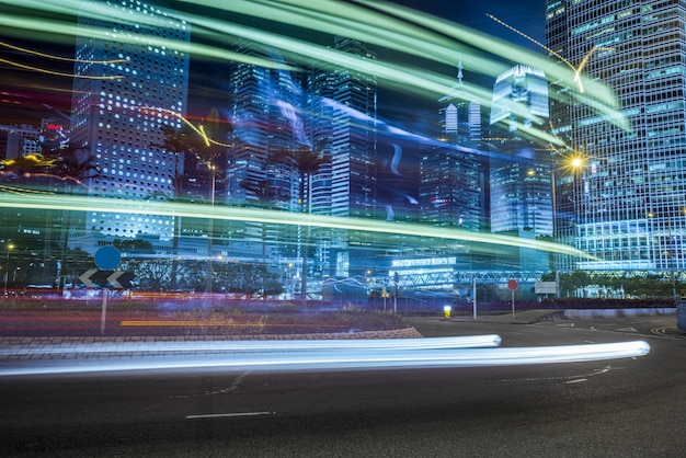 Modern urban construction and road vehicles, night view