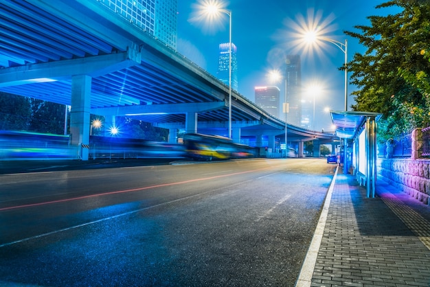 Modern urban construction and road vehicles, night view