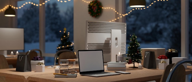 Modern urban office with Christmas decoration at night interior with computer desk