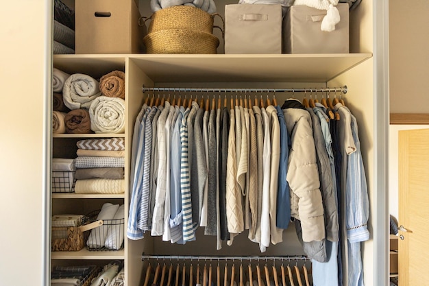 Modern wardrobe with stylish womens clothing concept of decluttering organizing and tidiness