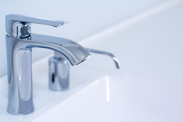 A modern water tap sink with faucet in minimalistic style 