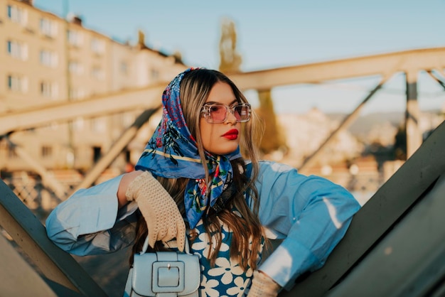 A modern woman walking the streets of the city dressed in modern clothes from the 19th century.