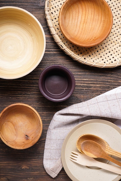 Modern wooden and ceramic crockery trendy tableware Dishes for serving and eating meals on a wooden background top view