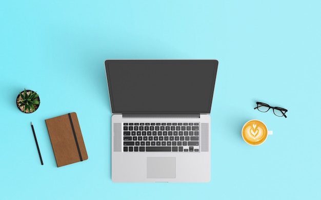 Modern workspace with coffee cup, notebook, smartphone and laptop on Blue color