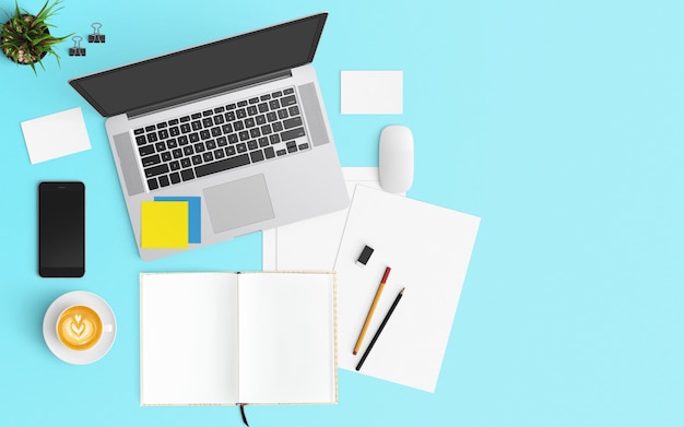 Modern workspace with coffee cup, notebook, smartphone and laptop on Blue color