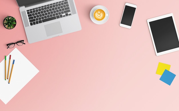 Modern workspace with coffee cup, notebook, smartphone and laptop on pink color