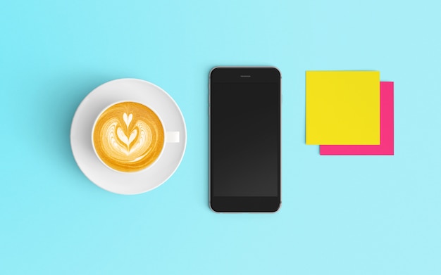 Modern workspace with coffee cup, notepad and smartphone on Blue color