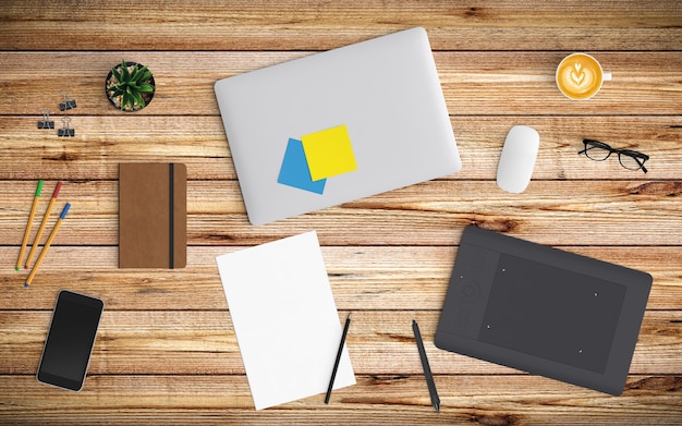 Modern workspace with coffee cup, paper, notebook, tablet or smartphone and laptop on wood