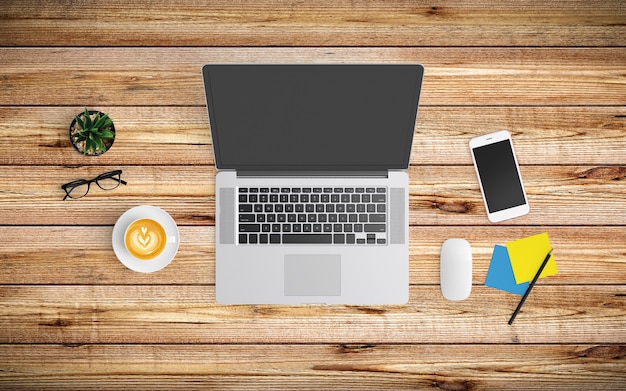 Modern workspace with coffee cup, paper, notebook, tablet or smartphone and laptop on wood