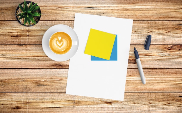 Modern workspace with coffee cup, paper and notebook on wood