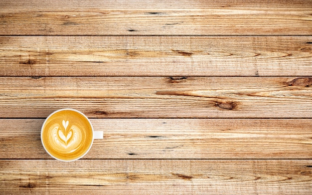 Modern workspace with coffee cup on wood