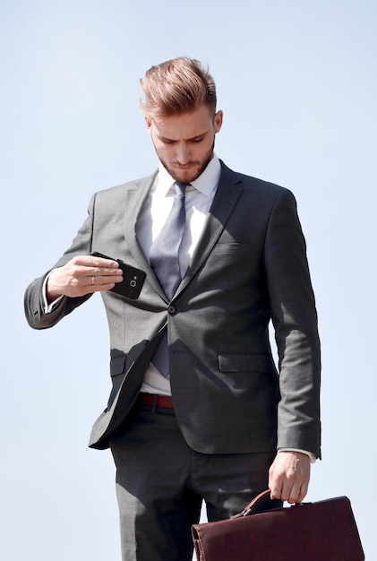 Modern young businessman with leather briefcase