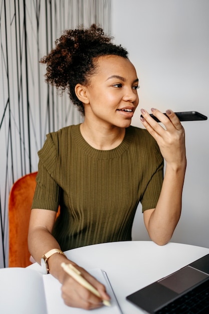 Modern young woman working from home