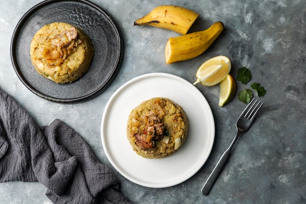 Mofongo, mashed  boiled plantains with porc meat, onion. Puerto Rico.  Amazonian cuisine, Peru, Cuba, Fufu de platano, tacaho