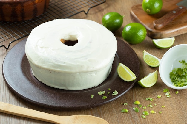 Moist lemon fruit cake on plate with lemon slices on wooden table Delicious breakfast traditional tea time Lemon cake recipe