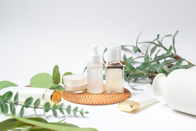 Moisturizing cream bottle over leaf background studio packing and skincare beauty conceptx9