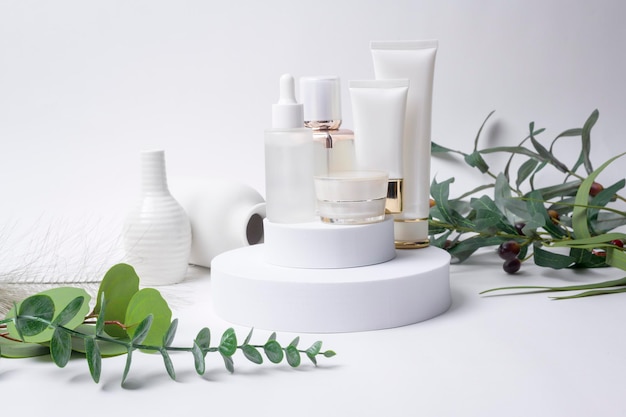 Moisturizing cream bottle over leaf background studio packing and skincare beauty conceptx9