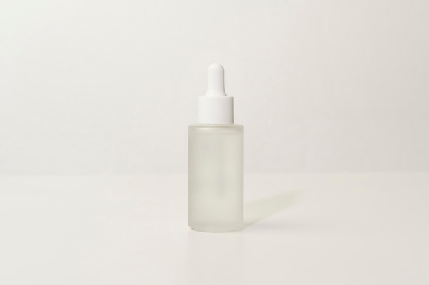 Moisturizing cream bottle over white background studio packing and skincare beauty concept