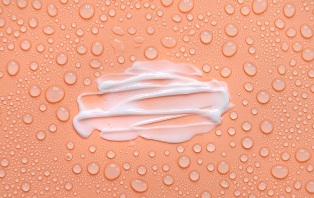 Moisturizing cream for face and body wet background Selective focus