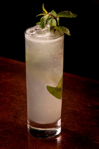 Mojito cocktail in long drink with mint and ice