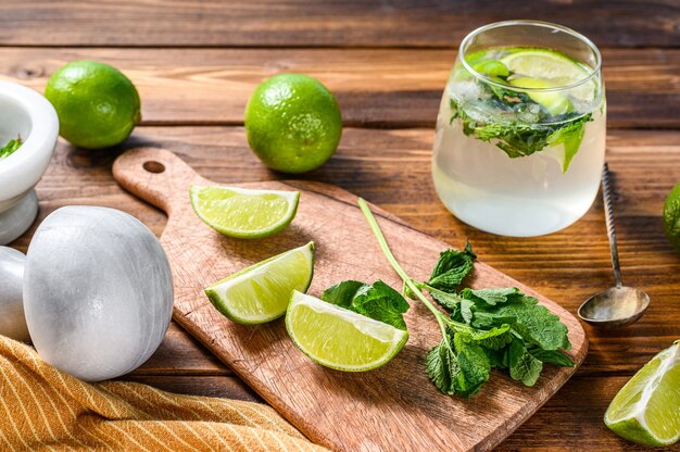 Mojito cocktail making. Ingredients  Mint, lime, ice and bar utensils.