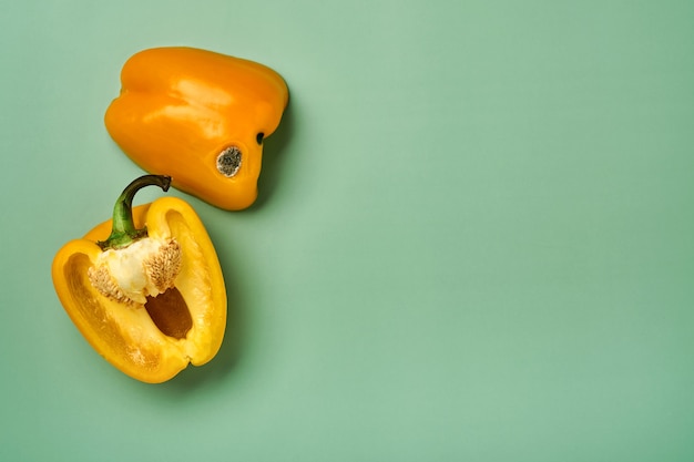 Moldy and wrinkled rotten cut in half yellow peppers