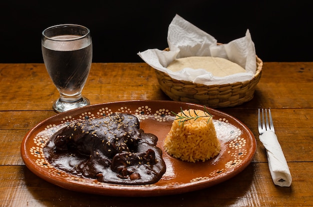 Mole typical Mexican food accompanied with rice