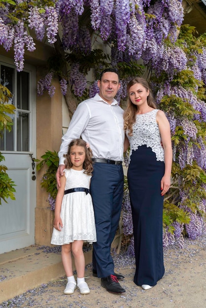 Mom dad and daughter Flower backgroundWisteria Warm close family relationship